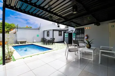 a patio with a pool and a table and chairs at Patimo Opulent Accommodation -Pretoria Mayville,Gezina in Pretoria