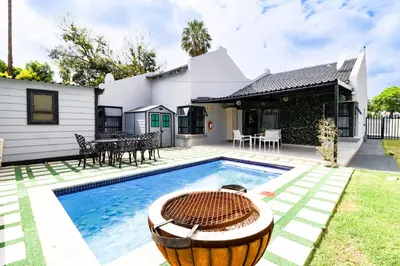 a house with a swimming pool in the yard at Patimo Opulent Accommodation -Pretoria Mayville,Gezina in Pretoria