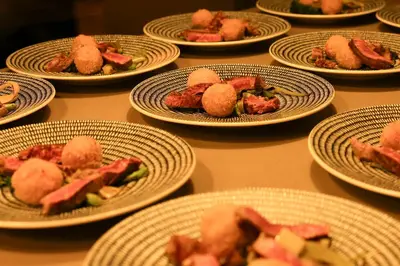 a bunch of plates of food on a table at Villa Kudu - Exclusive and Serviced Safari Villa near Kruger Park in Hoedspruit