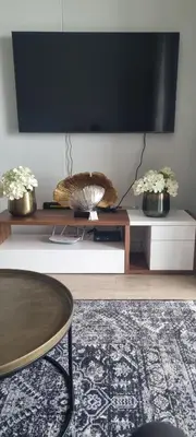 a living room with a tv and a coffee table at Ellipse Waterfall City Luxury Apartment - Bigger Apartment than Most - Middle floor in Midrand