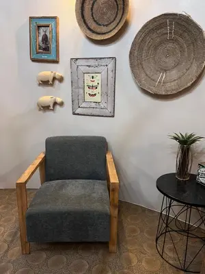 a chair and a table in a room at Armonia in Ermelo