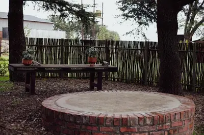 a picnic table and a bench in a yard at Armonia in Ermelo