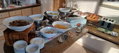 a kitchen counter with bowls of food on it at Road Lodge Centurion in Centurion