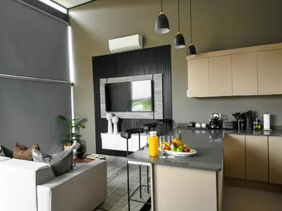 a kitchen with a table with a bowl of fruit on it at The Anza Lifestyle Lodge in Louis Trichardt