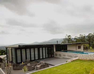a house with a swimming pool and a patio at The Anza Lifestyle Lodge in Louis Trichardt