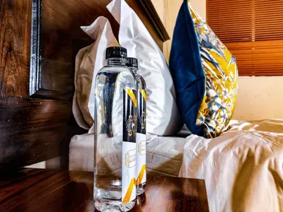 a bottle of water on a table on a table at Lemba Lodge in Dwarsrivier