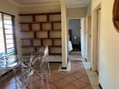 a dining room with a table and chairs at Centurion Ambient Townhouse in Centurion
