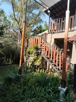a wooden staircase leading up to a house at Edwil's Place in Hartbeespoort