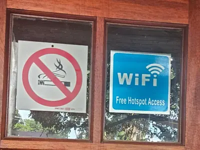 two signs in the window of a hospital at Grobler's Haven Self catering cottage in Pretoria