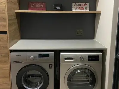 a laundry room with a washer and a dryer at Highland Gate Dullstroom by Cloete's Nest in Dullstroom