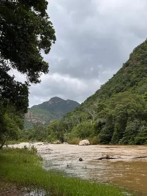 a river with mountains in the background at Blyde River Self-Catering Studios in Hoedspruit