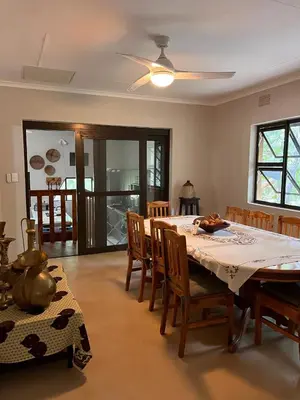 a dining room with a table and some chairs at Blyde River Self-Catering Studios in Hoedspruit