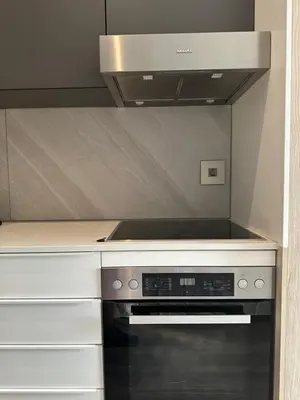 a kitchen with a black stove top oven at The Capital Trilogy Menlyn Maine Apartments 913 in Pretoria