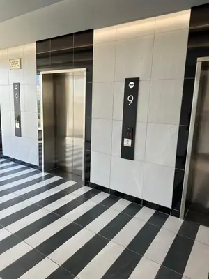 a hallway with two elevators in a building at The Capital Trilogy Menlyn Maine Apartments 913 in Pretoria
