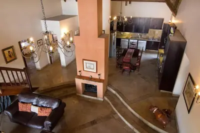 an overhead view of a living room and kitchen at Zebula Golf and Wildlife Estate - Jackals Call Pax 8 - Moi Signature Luxury villa in Mabula
