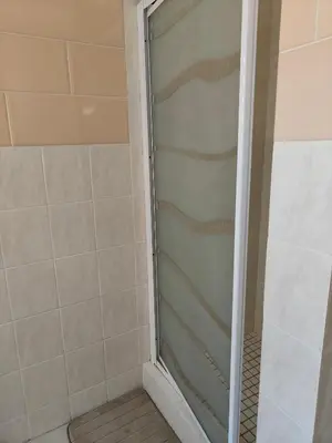 a shower with a glass door in a bathroom at Unit 89 Pendleberry Holiday Resort in Bela-Bela