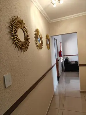a hallway with three mirrors on the wall at Unit 89 Pendleberry Holiday Resort in Bela-Bela