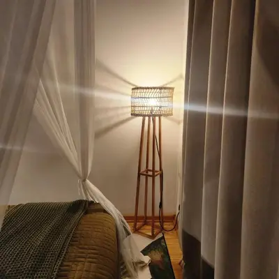 a bedroom with a bed with a canopy and a lamp at Amare Cabin in the bush with all your needs! in Marloth Park