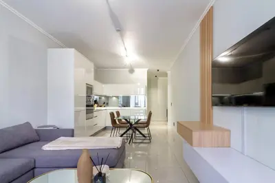 a living room with a purple couch and a table at #AlimamaSpaces: Jay's Cassini in Midrand