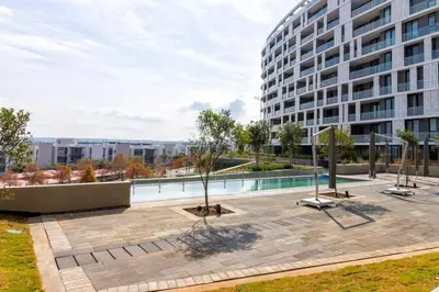 a large building with a courtyard with a pool at #AlimamaSpaces: Jay's Cassini in Midrand