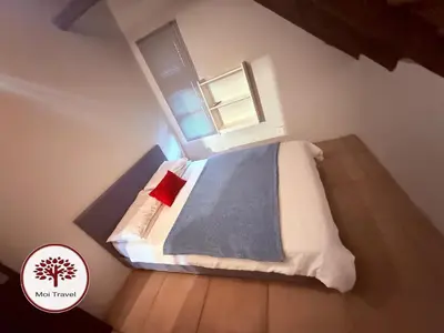 a small bedroom with a bed and a window at Zebula Golf and Wildlife Estate - Nights Sky Pax 16 - Moi Signature Luxury villa in Mabula