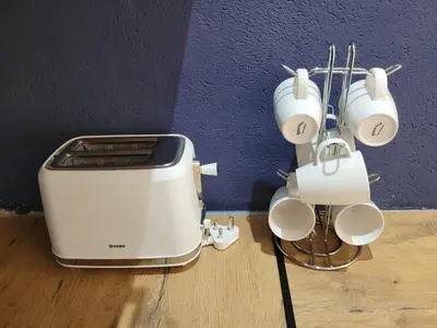 a toaster and coffee pots and pans on the floor at Nguni House in Mataffin