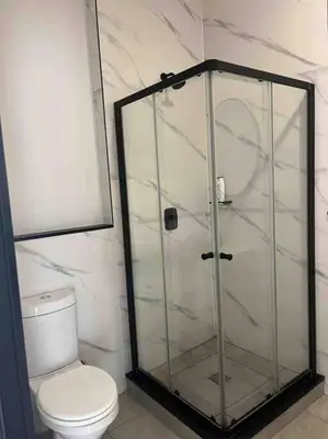 a bathroom with a toilet and a glass shower at Executive Penthouse in Midrand, Waterfall City - Fast WiFI and Secure Parking - 3 Elizabeth Place in Midrand