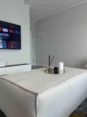 a white bed with a tray on top of it at Executive Penthouse in Midrand, Waterfall City - Fast WiFI and Secure Parking - 3 Elizabeth Place in Midrand