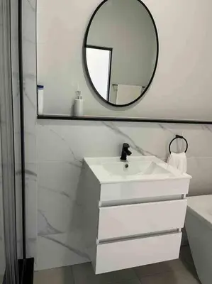 a bathroom with a white sink and a mirror at Executive Penthouse in Midrand, Waterfall City - Fast WiFI and Secure Parking - 3 Elizabeth Place in Midrand