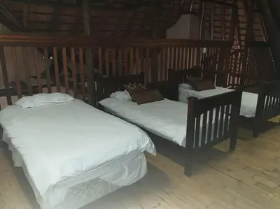 three beds in a room with white sheets at Zebula Golf and Wildlife Estate - Great Heights Pax 16 - Moi Signature Luxury villa in Mabula