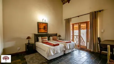 a bedroom with two beds and a piano at Zebula Golf and Wildlife Estate - Open Horizon Pax 8 - Moi Signature Luxury villa in Mabula