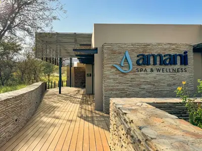 a sign on the side of a spa and wellness building at Radisson Safari Hotel Hoedspruit in Hoedspruit