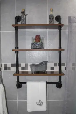 a shelf in a bathroom with towels on it at Villa La Sola B&B and Self-Catering in Boksburg