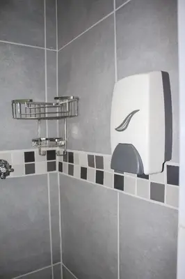 a bathroom with a toaster hanging on the wall at Villa La Sola B&B and Self-Catering in Boksburg