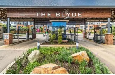 a building with a sign that reads the bulgue at The Blyde Holiday beach in Pretoria