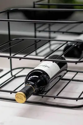 a bottle of wine sitting on a stove at Epic Getaway in Waterfall in Midrand