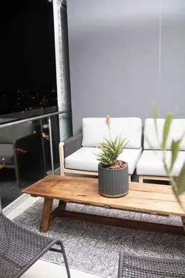 a living room with a couch and a coffee table at Epic Getaway in Waterfall in Midrand