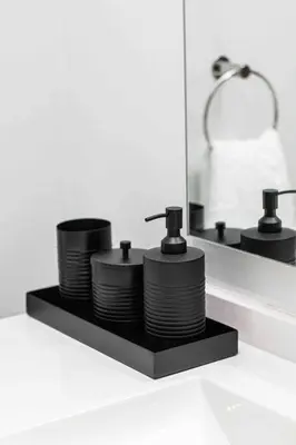 a pile of plates on a shelf in front of a mirror at Epic Getaway in Waterfall in Midrand