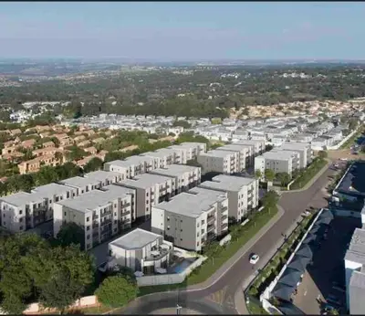 an aerial view of a city with white buildings at Blest5 Tranquil Stay in Midrand