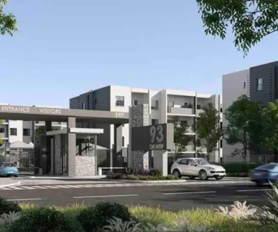a building with a car parked in a parking lot at Blest5 Tranquil Stay in Midrand