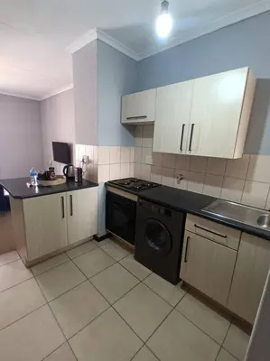 a kitchen with a stove and a dishwasher at Budget-Friendly & Cozy Haven by BK Hospitable in Midrand