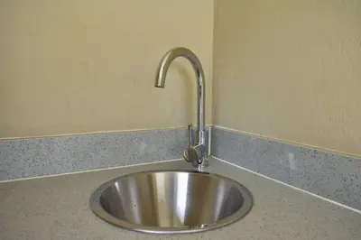a stainless steel sink in a kitchen counter at Candymore luxury apartment in Midrand