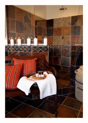 a room with a couch and a table with candles at Jembisa Bush Home in Melk River