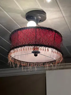 a red chandelier hanging from a ceiling at 17 Byvanger Luxury Home Deluxe Queen Suite Room 1 in Centurion