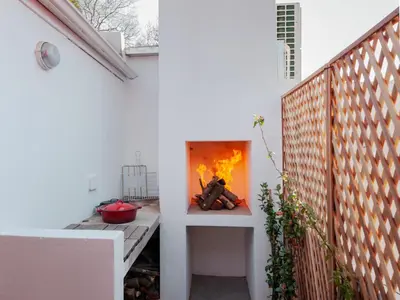 a fireplace in the side of a house at Milner Fashion House in Pretoria