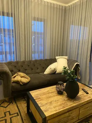 a living room with a couch and a coffee table at Green Valley Bliss in Boschrand
