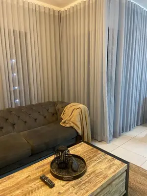 a living room with a couch and a coffee table at Green Valley Bliss in Boschrand