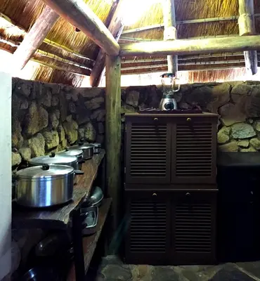 a kitchen with a bunch of pots and pans at Sheba Rock Guesthouse in Nelspruit