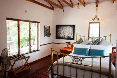 a bedroom with a bed and a window at The Blue Place in Pretoria