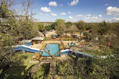 an overhead view of a swimming pool in a park at Vuurvliegie in Marloth Park